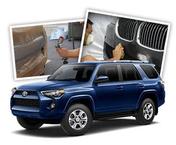 A Toyota 4Runner in front of images of scuffed bumper repair training.